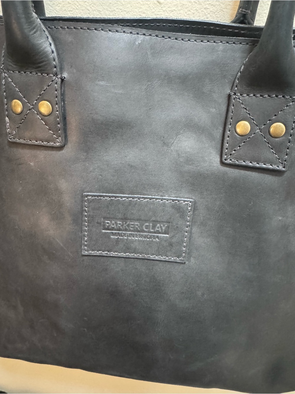 Parker Clay Merkato Signature Leather Tote Bag in black.